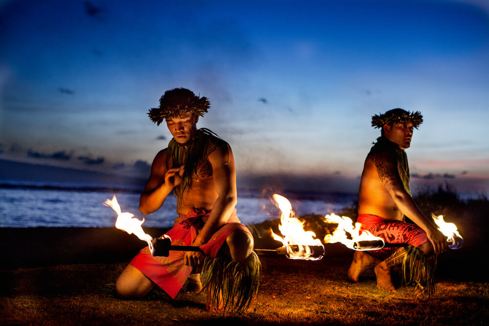 Two people performing at one of the best luau in Kauai.