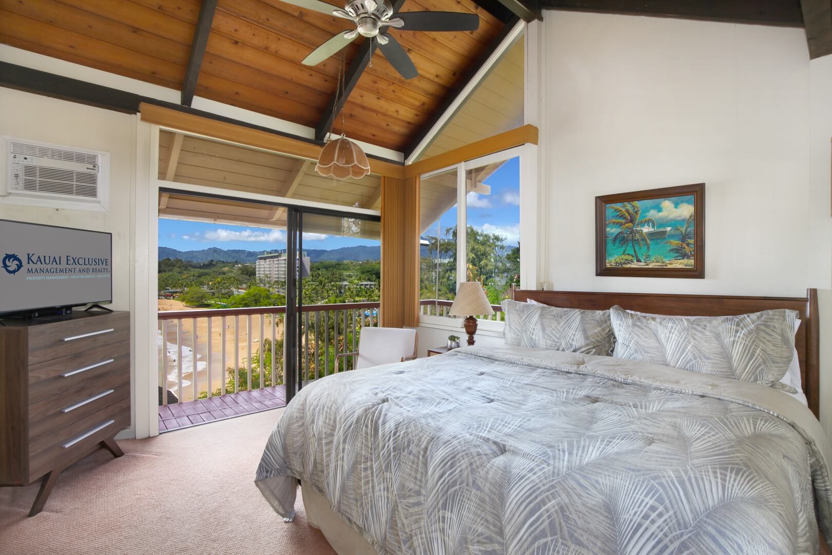 The bedroom of a vacation rental in Lihue to relax in after checking out things to do.